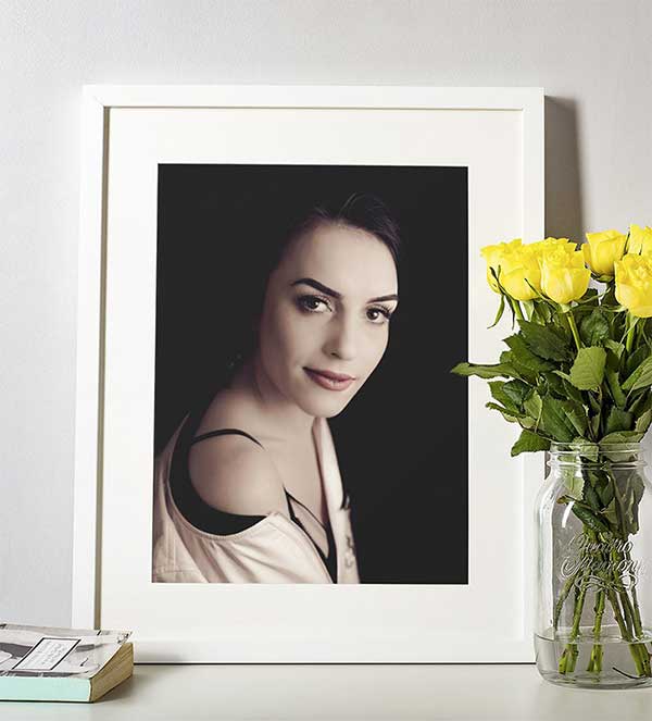 Online printing and framing in white wood frame
