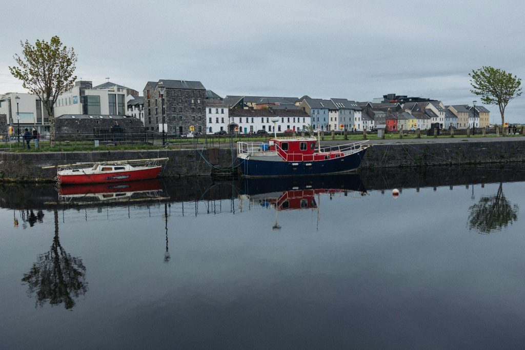 Boats tied up along a dock in Galway